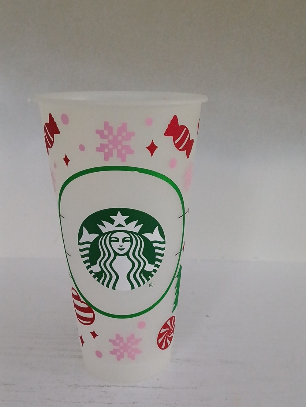 Starbucks White Plastic Holiday Cup with Green Logo and Pink & Red Accents